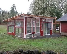 Mike designed and built a greenhouse with recycled windows.