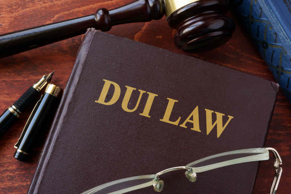 Gavel on the table with Duii law book .