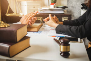 Lawyer is sitting on table and discuss about the case