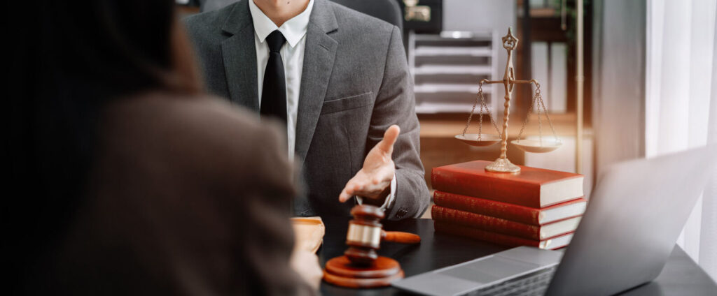 Lawyer is sitting on the table and discuss about the case .